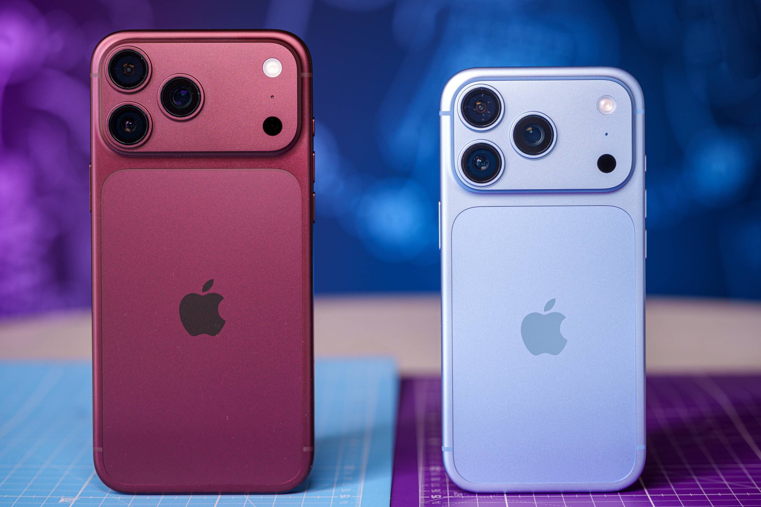 iPhone 18 Pro Max in Burgundy next to iPhone 18 Pro in Glacier Blue